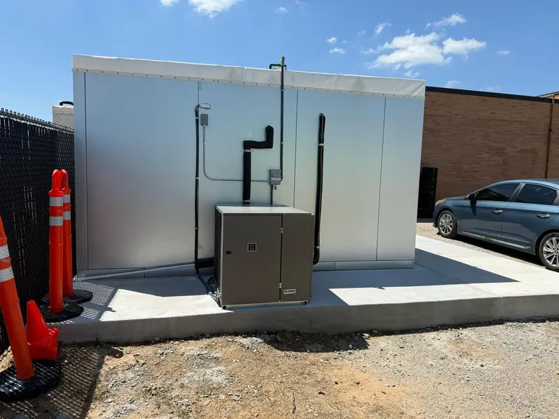 Walk-in cooler box outside a business